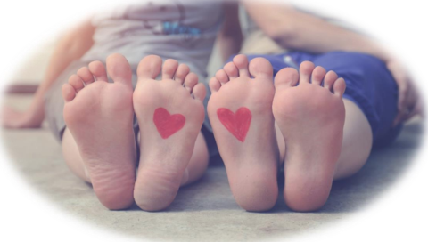 children's feet with hearts on the bottom